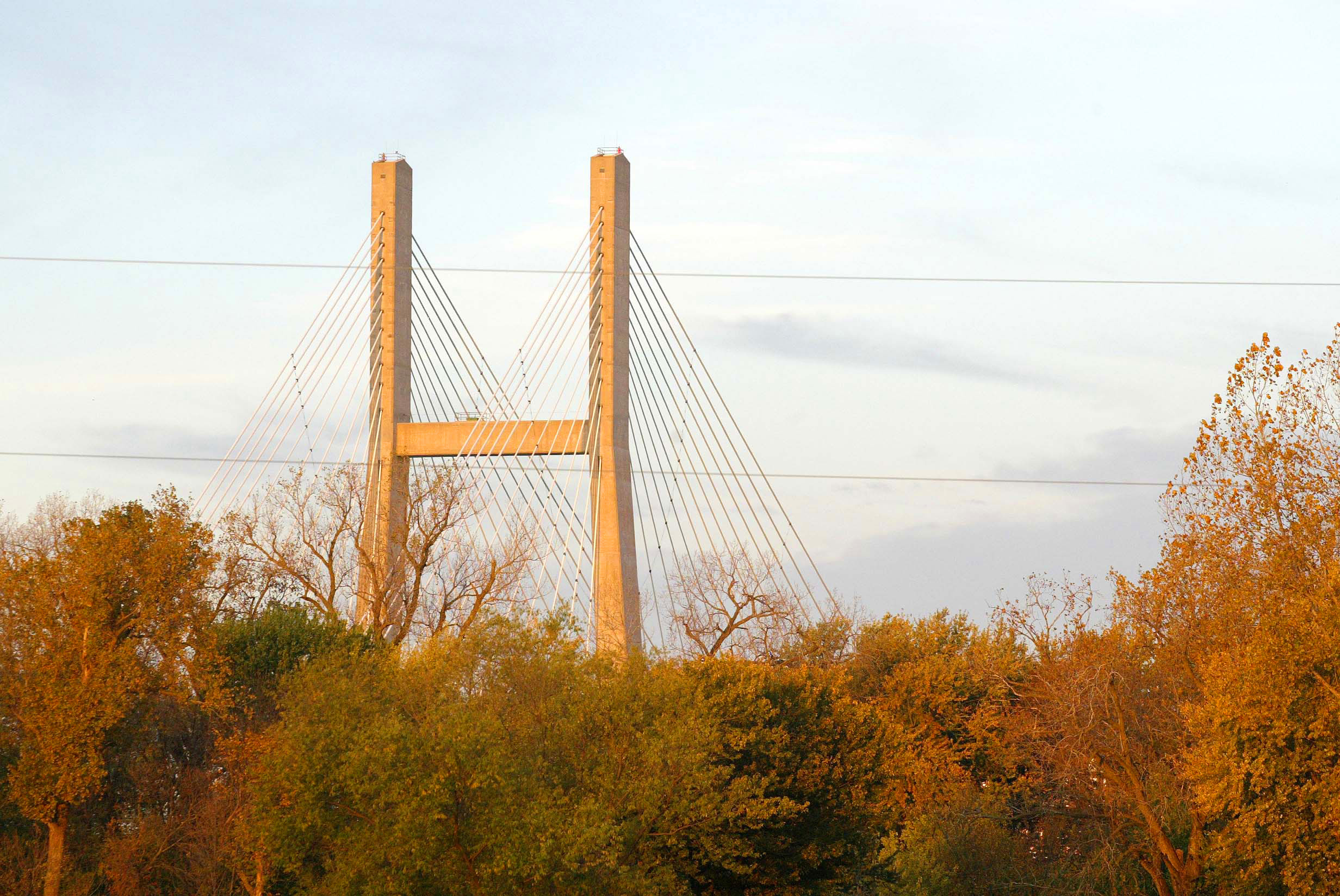 The Great River Bridge rises above the fall colors Oct. 20, 2003 looking to the west from Gulfport, Illinois. | John Gaines | The Hawk Eye